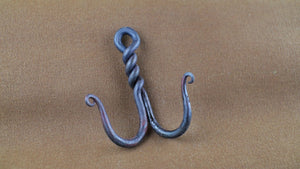 For the hook of the week this week, lets look at a simple double hook from a piece of 1/4" round bar bent double then twisted leaving an eye for hanging.