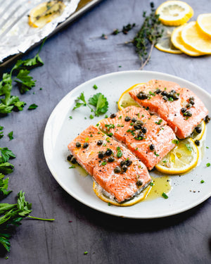 This salmon with capers is oven baked in foil until it’s perfectly tender, then topped with a delicious garlic butter sauce